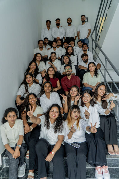 The SpazioLiv team group photo on the staircase
